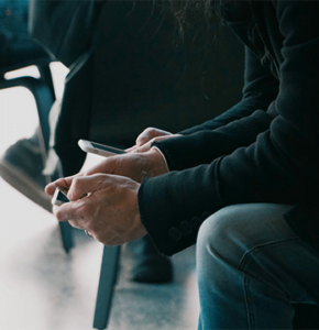 Close up of someone's hands holding a cellphone