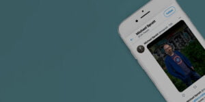 Close up of iPhone with Michael Spratt Twitter feed